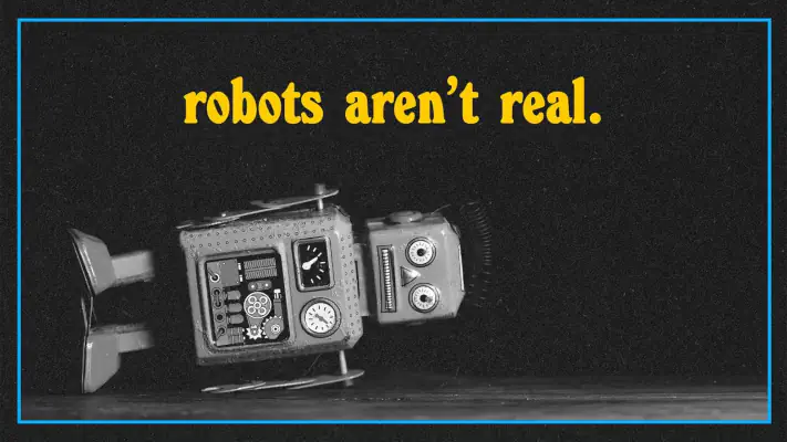 at the top is written robots aren't real and below is a toy robot fallen on its side.